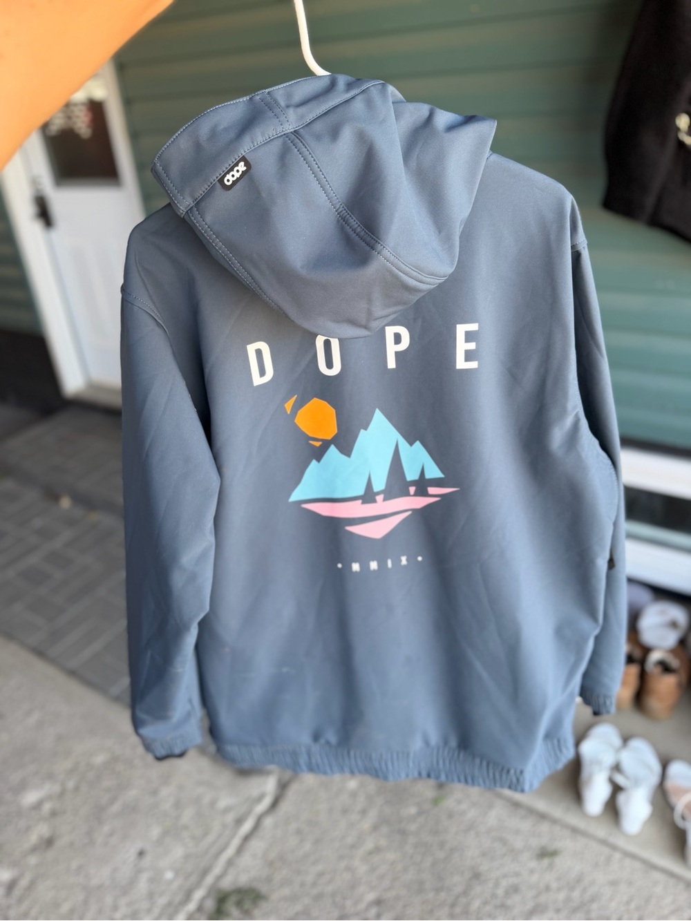 DOPE Slate Blue Hooded Ski Jacket with Colorful Mountain Graphic